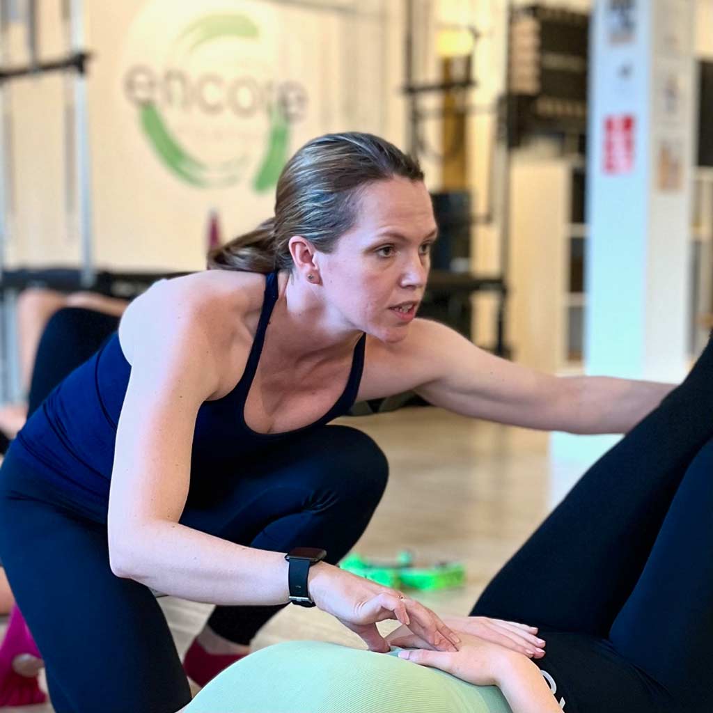Katie O'Neill teaching at Encore Pilates